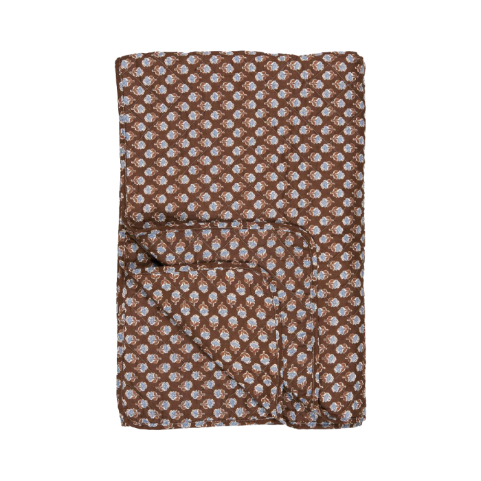 Brown quilt with blue floral pattern