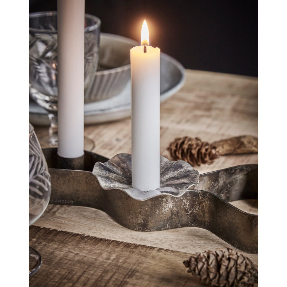 Candle holder with candle and light wreath from House Doctor