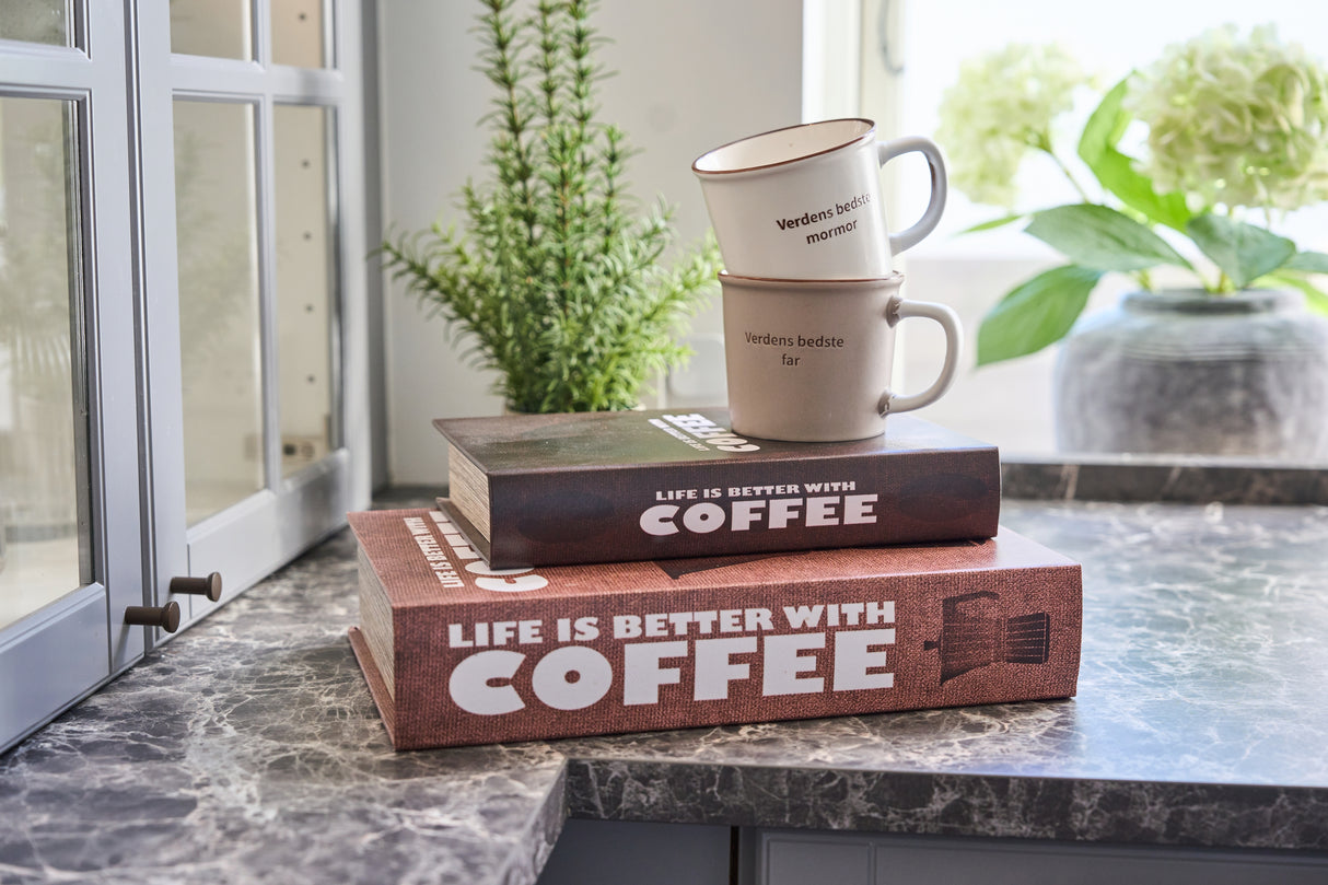 to bogformede opbevaringsbokse med kaffetema med to kaffekopper ovenpå
