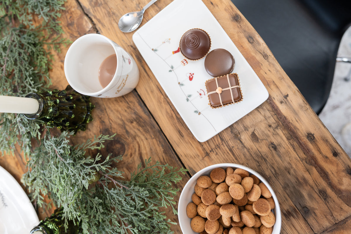 Porcelain Christmas tableware set on dining table, top view