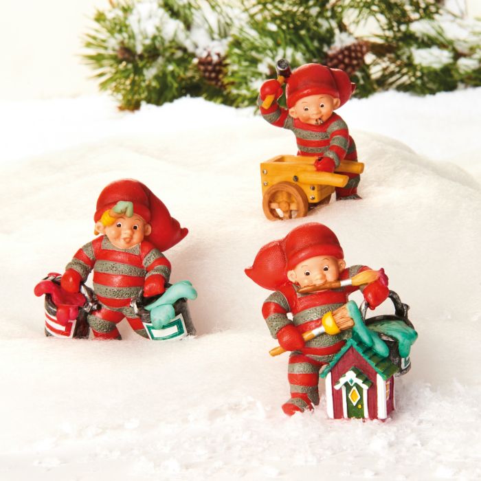 Baby elf prepares Christmas gifts