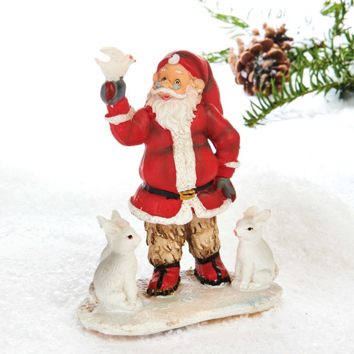 Julemanden står på en isflage med sneharer. Han kigger over sine julebriller op på den hvide due, han holder i sin hånd. Fredsfyldt julemand fra pobra.