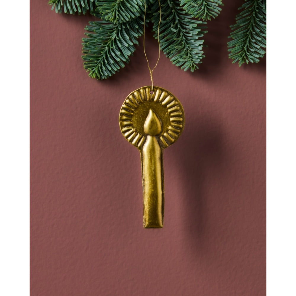 Metal hanging ornament shaped like a candle with a flame wreath from House Doctor