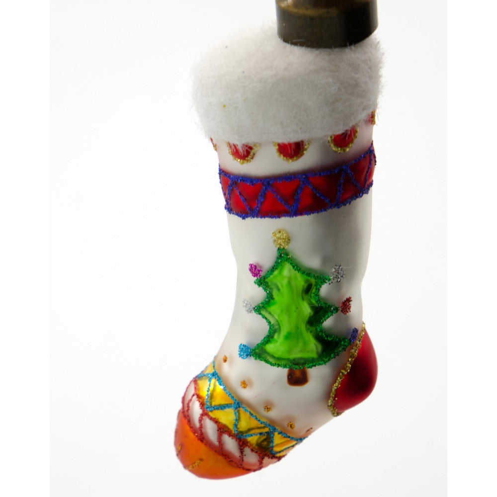 Close-up of a glass Christmas ornament shaped like a small Christmas stocking from House Doctor