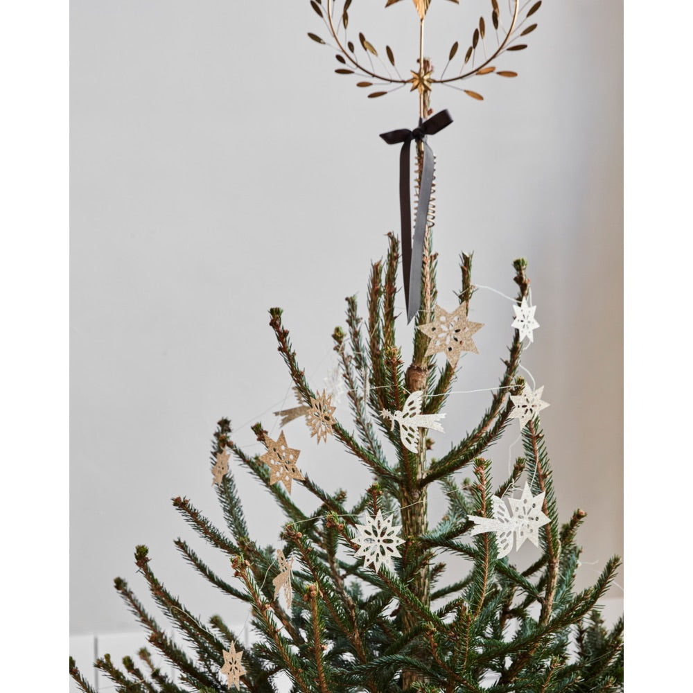 Gold-glitter garland with figurines from House Doctor on the Christmas tree