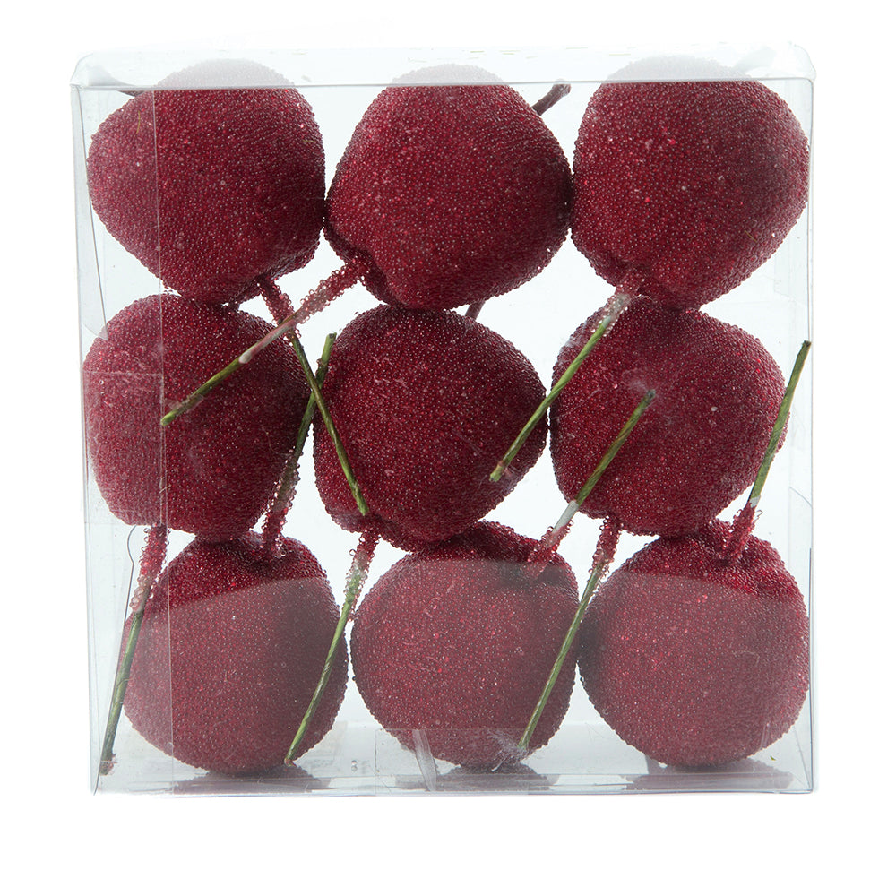 Red candy apples on wooden sticks for decoration