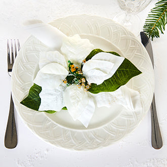 Napkin ring with white poinsettia for the Christmas table
