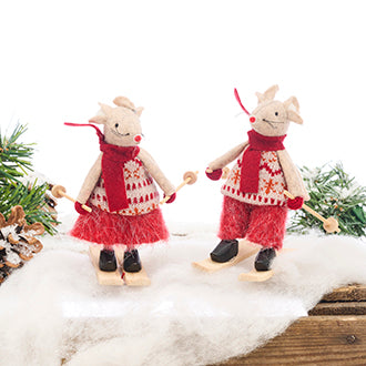 Mouse in winter clothes skiing in the snow for decoration