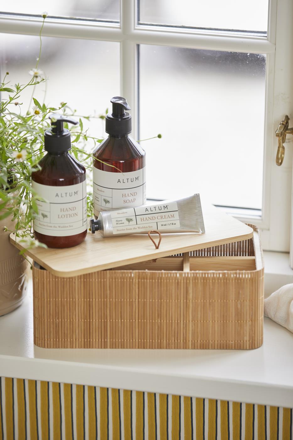ALTUM Meadow hand lotion and other care products from Ib Laursen on a bright bathroom shelf