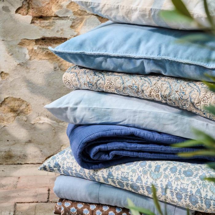 Brown quilt with blue floral pattern