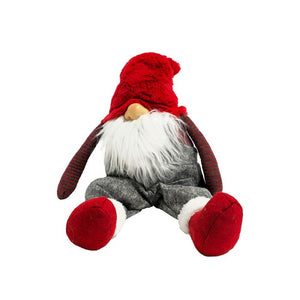 Gnom med rødt tøj siddende