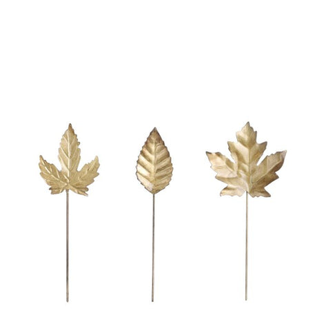 Guldfarvede blade på spyd