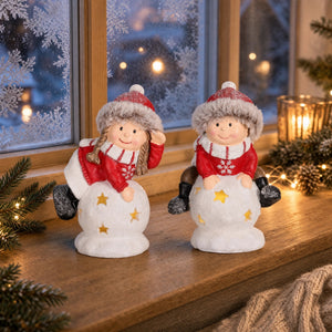 Boy and girl on snowball