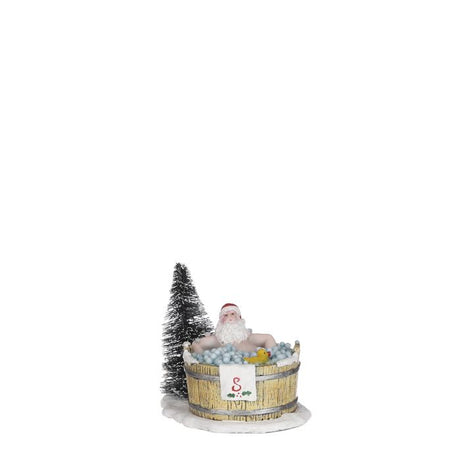 Julemanden tager et pusterum fra juleræset i et skønt boblebad med en gul and. Baljen står på en sneflage med et snebeklædt grantræ i baggrunden. Skæg julemand fra Luville. 