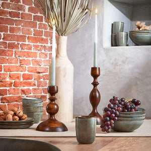 Tabo stentøjsserien grøn 20 cm på bord med stearinlys