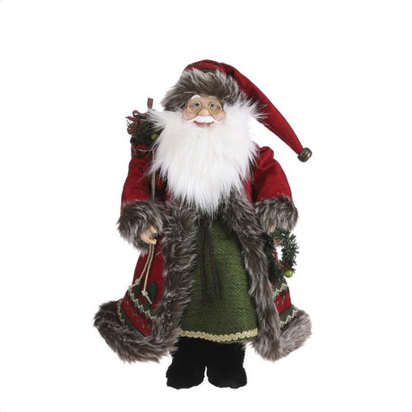 Stor Julemand med varm frakke i smukke detaljer og pelskant. Julemanden har gavesækken på ryggen og smiler smittende.