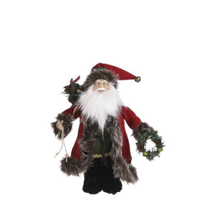Julemand med varm frakke og kønne detaljer. Han har julesækken på ryggen og en fin julekrans i hånden.
