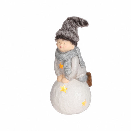 Winter children on lighted snowball