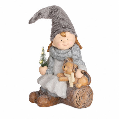 Winter children on log