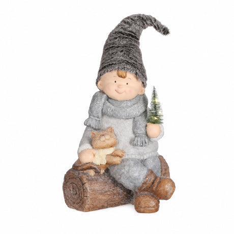 Winter children on log