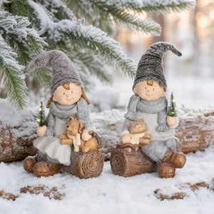 Winter children on log