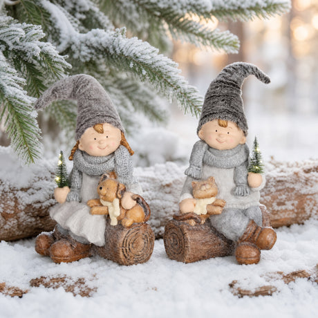 Winter children on log