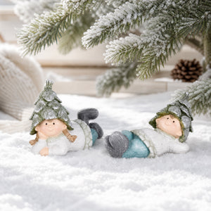 Recumbent winter children with cone hats