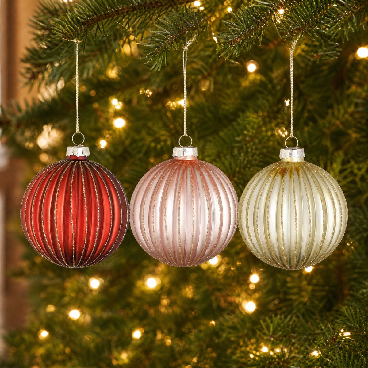 Christmas balls with shimmering stripes