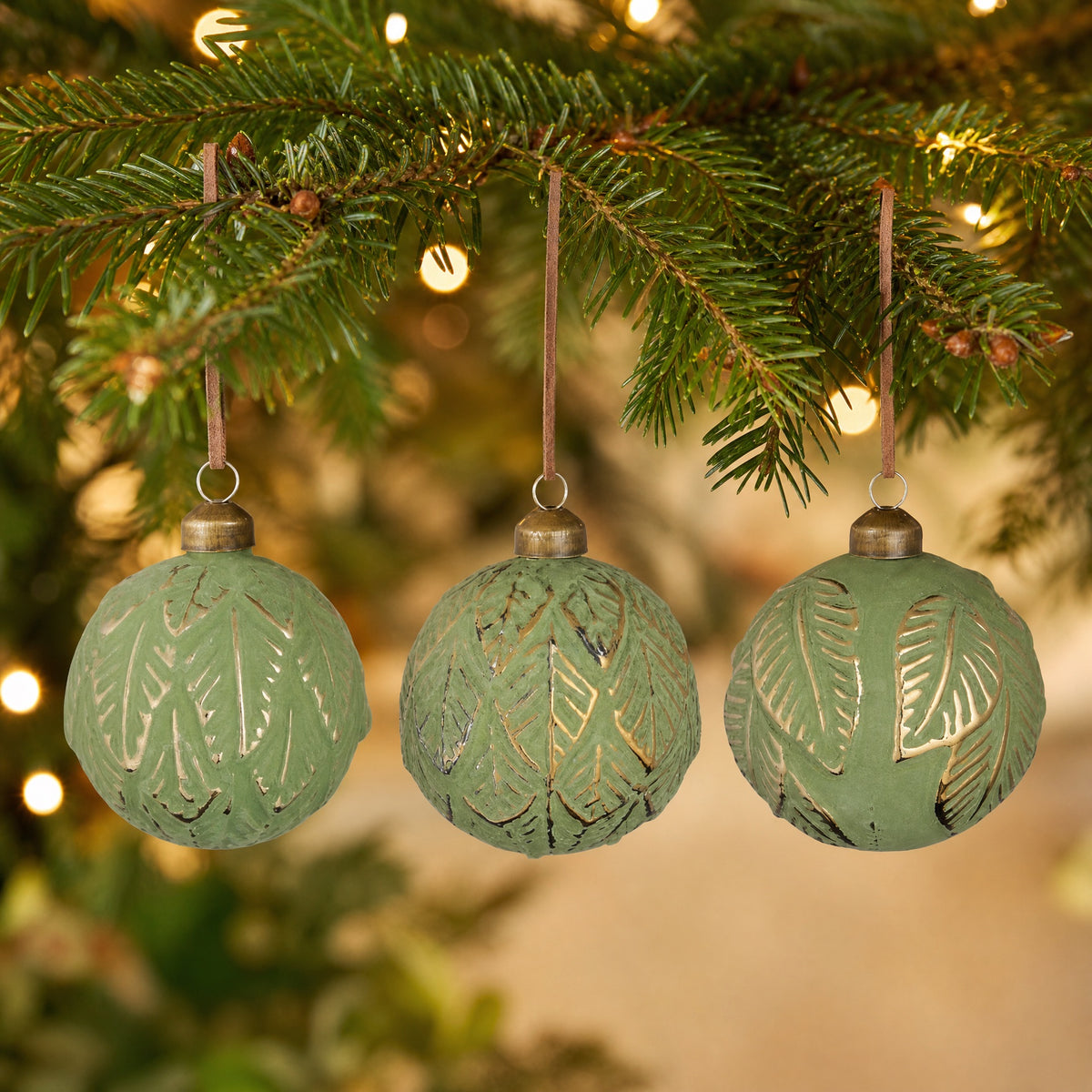 Green Christmas ball with leaf pattern