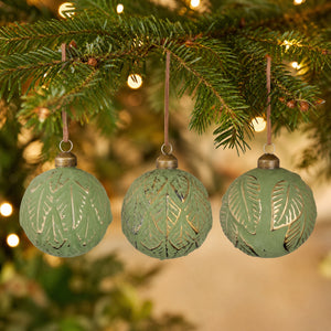Green Christmas ball with leaf pattern
