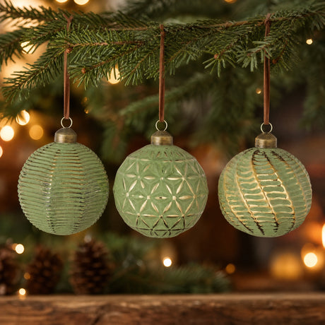 Green Christmas balls with golden pattern