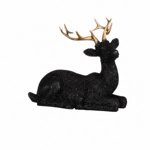 Recumbent sparkling black deer