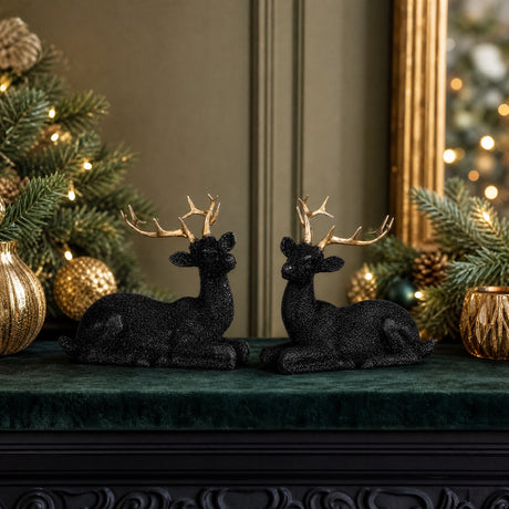Recumbent sparkling black deer