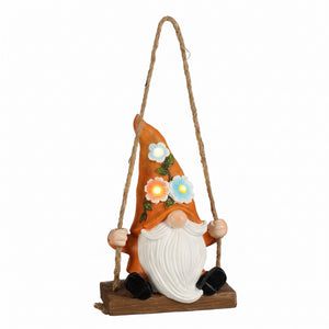 Garden gnome on swing with solar lights