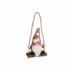 Garden gnome on swing with solar lights
