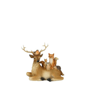 Lying deer with forest animals
