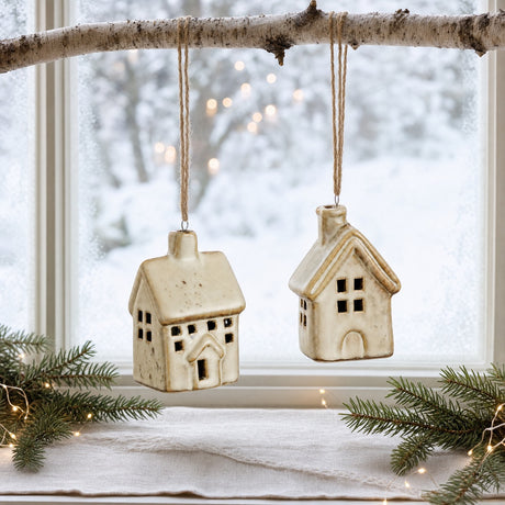 Branch in a window with hanging porcelain houses