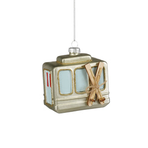 Gold-colored glass Christmas ornament shaped like a ski gondola