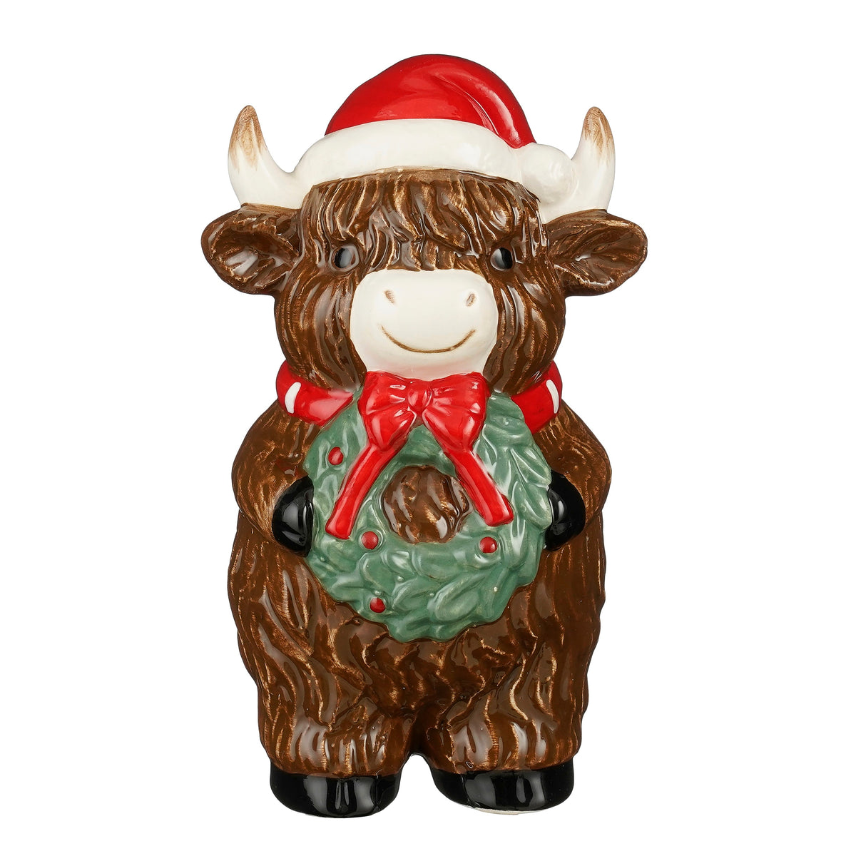 Cow wearing a Santa hat and a Christmas wreath