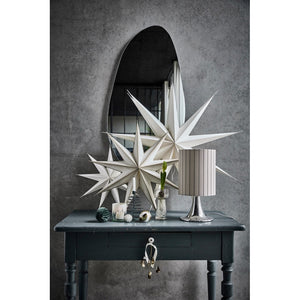 Console table with star decorations, lamp and interior accessories from House Doctor
