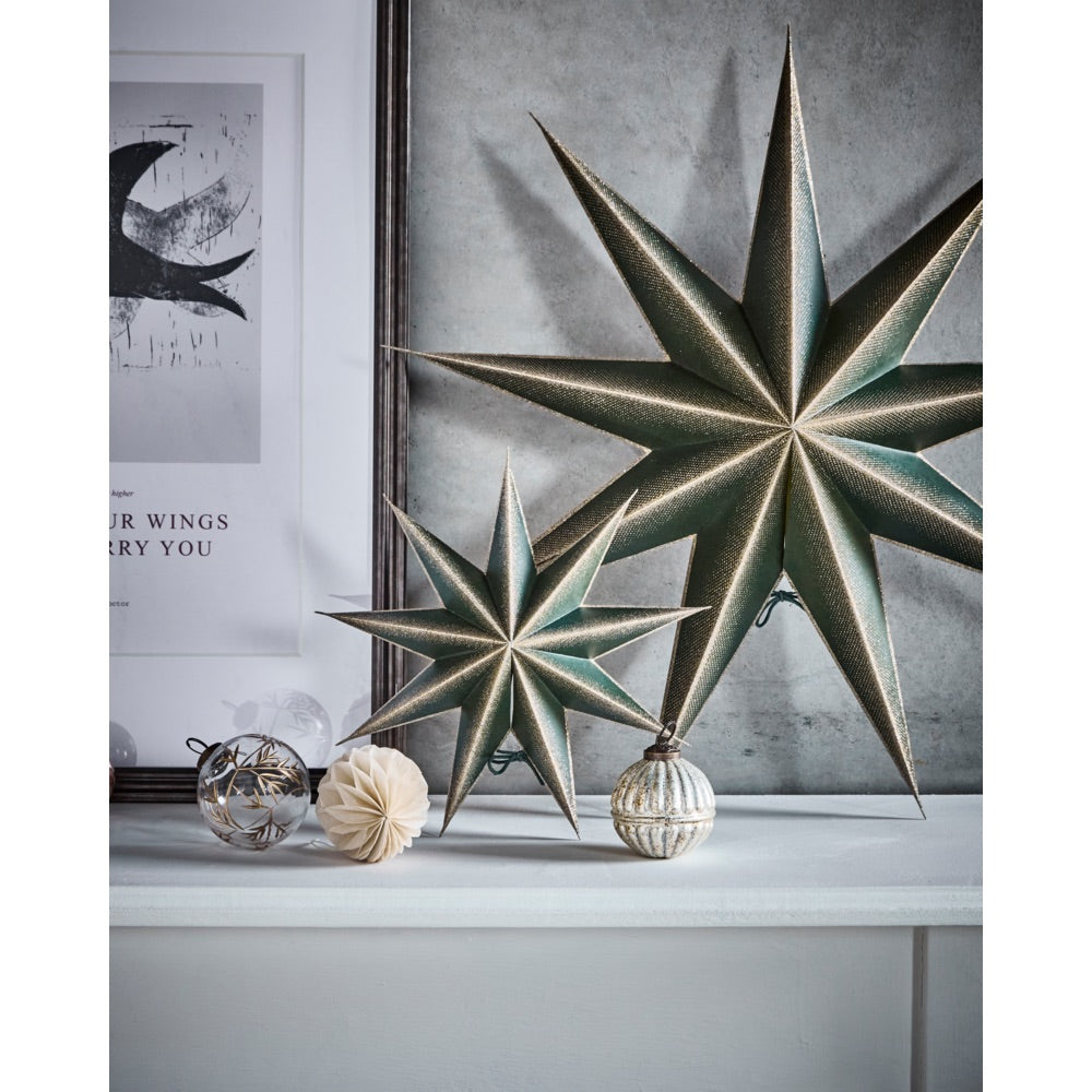 Stars in two sizes from House Doctor on a shelf