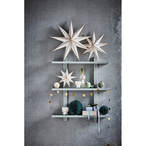 Wall shelves decorated with a star and Christmas decorations from House Doctor