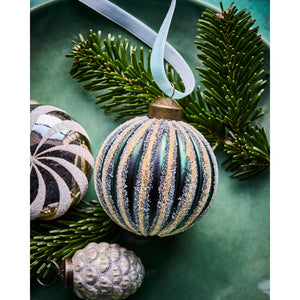 3 different glass Christmas baubles from House Doctor decorated with spruce sprigs and light blue velvet ribbon