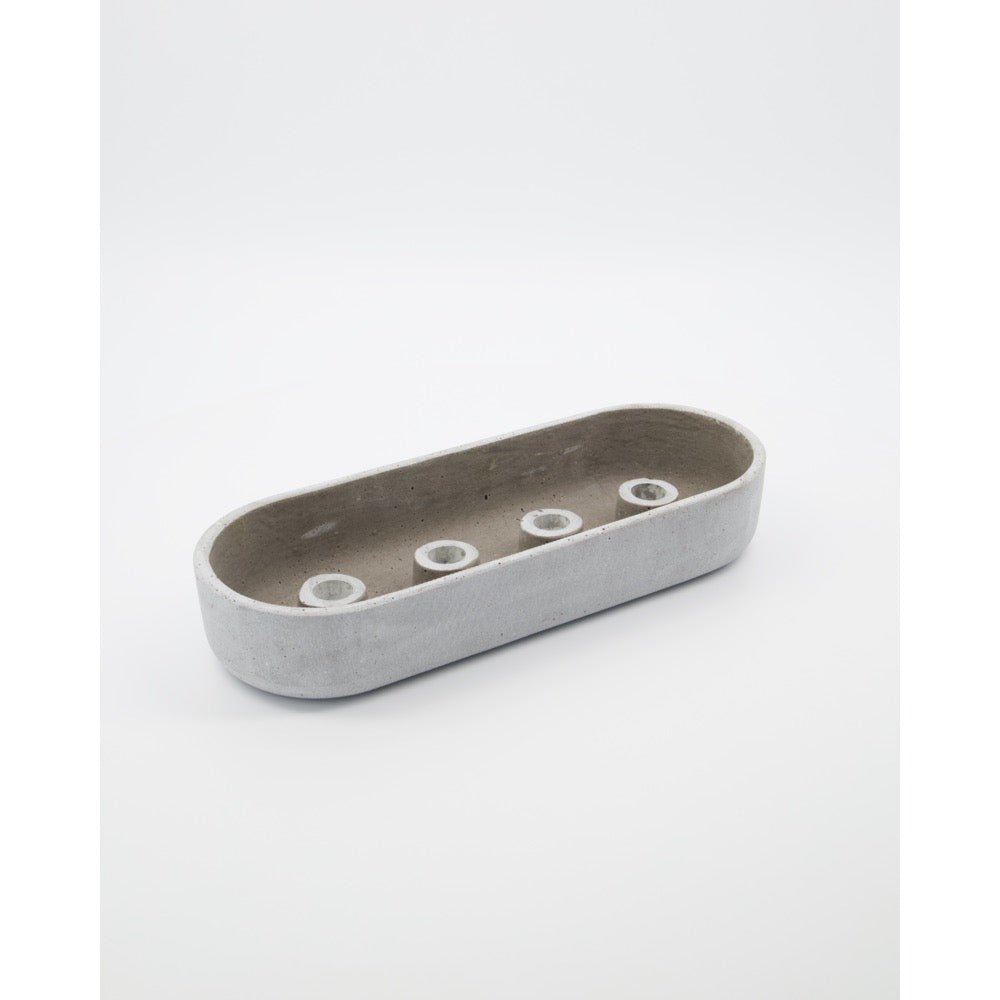 Grey concrete candle holder with four candle sockets in the base from House Doctor