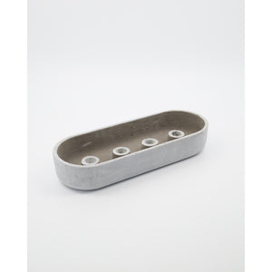 Grey concrete candle holder with four candle sockets in the base from House Doctor