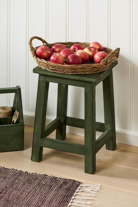 Green-painted pine stool from Ib Laursen with a basket of apples