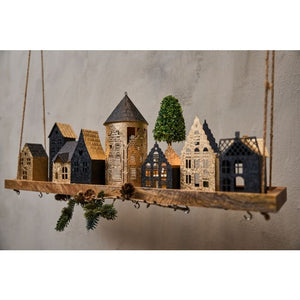 Lyshus i metal rundt guld