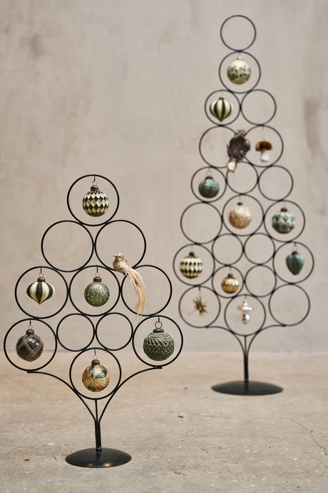 Black metal Christmas trees in two sizes from Speedtsberg, decorated with baubles