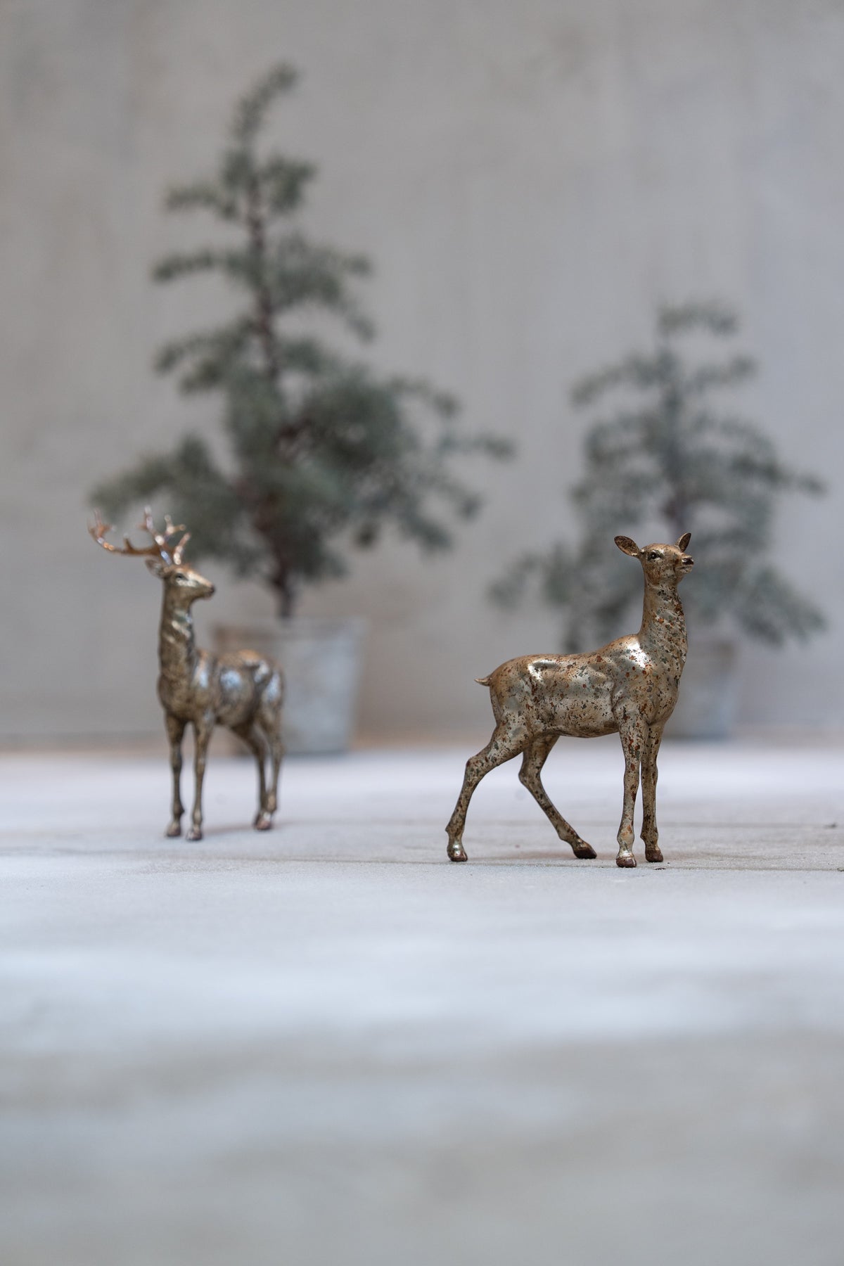 Deer figurines with and without antlers in antique gold finish from Speedtsberg