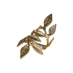 Napkin ring from Speedtsberg in antique gold-colored aluminum, featuring a large branch with detailed leaves; motif is 12 cm high
